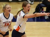 Frisco ISD’s Wakeland High School volleyball players Audrey Clark (13) and Jessica Jones (7)...