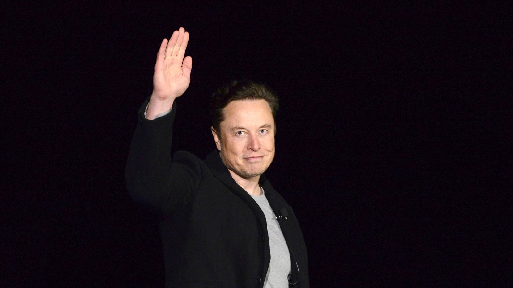 FILE - SpaceX's Elon Musk waves while providing an update on Starship, on Feb. 10, 2022,...