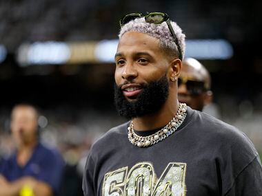 Odell Beckham Jr. is seen on the sidelines before an NFL football game between the New...