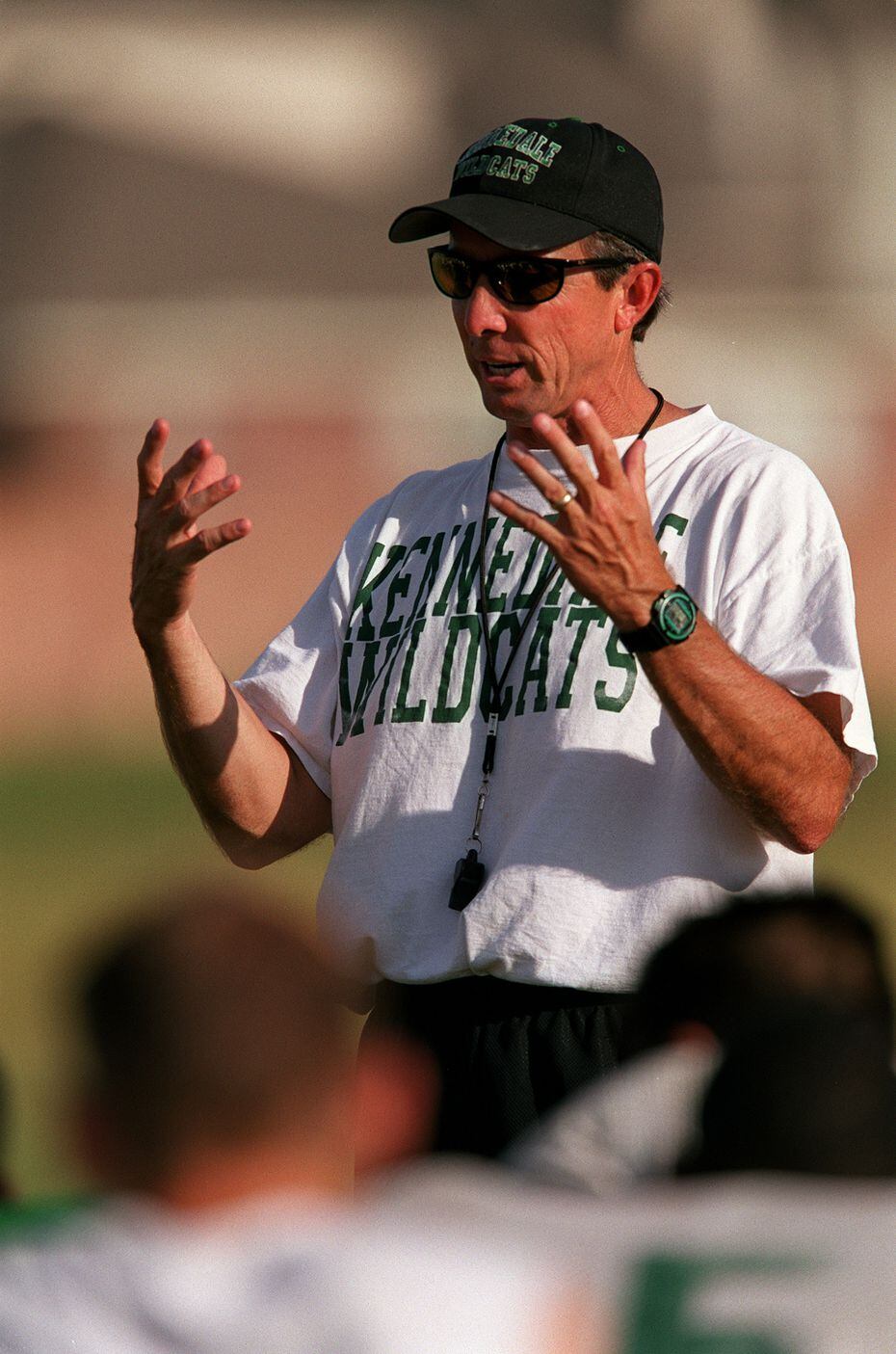 FILE: Kennedale High School football head coach Richard Barrett talks to his players at the...