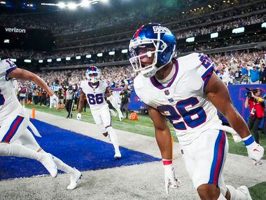 New York Giants running back Saquon Barkley (26) celebrates after scoring on a touchdown ...