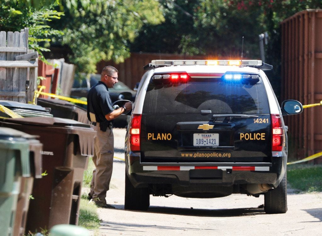 Plano police and the Texas Rangers work the scene of a shooting Sunday night at a home in the 1700 block of West Spring Creek Parkway in Plano. Eight people were fatally shot, and their attacker was killed by a police officer. 