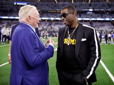 Former Dallas Cowboys player and current University of Colorado coach Deion Sanders (right)...