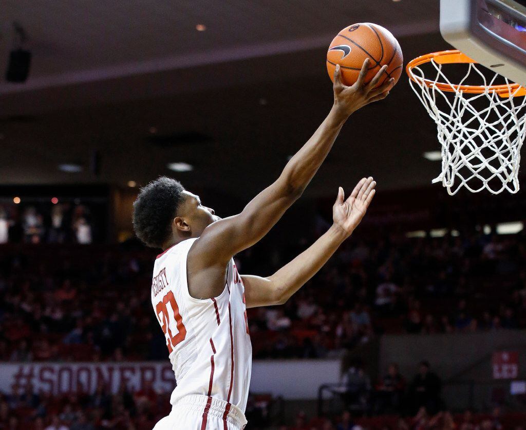 Oklahoma guard Kameron McGusty (20) shoots in the second half of an NCAA college basketball...