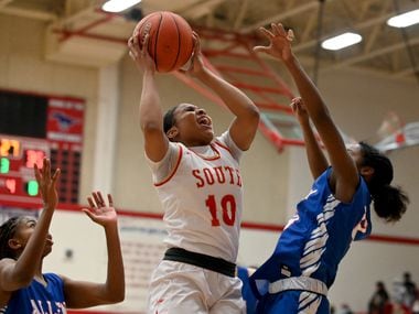 South Grand Prairie’s Victoria Dixon (10) grabs a rebound between Allen’s Alicia Mills and Zoe Jackson in the second half of a Class 6A area-round playoff game Saturday. SGP won 61-45. (Matt Strasen/Special Contributor)