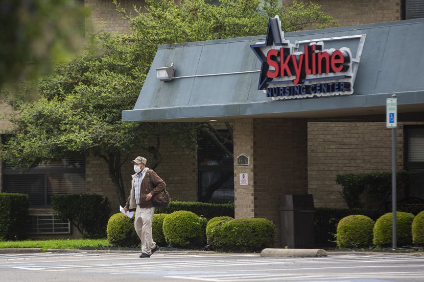 A man wearing a masks exits the Skyline Nursing Center in Oak Cliff on March 30, 2020 in...