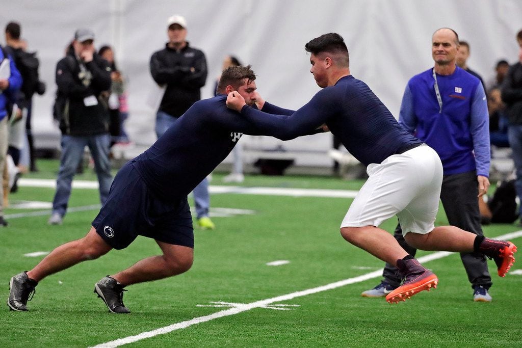 Penn State offensive linemen Connor McGovern, left, and Ryan Bates run a drill during Penn...