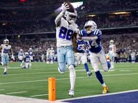 Dallas Cowboys wide receiver CeeDee Lamb (88) rolled off a defender and ran the ball in for...
