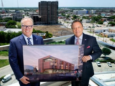 Jim Hinton, CEO of Baylor Scott & White Health (left) and Jeff Fehlis, executive vice president of the American Cancer Society South Region, pose with a rendering of the Gene and Jerry Jones Family Hope Lodge.