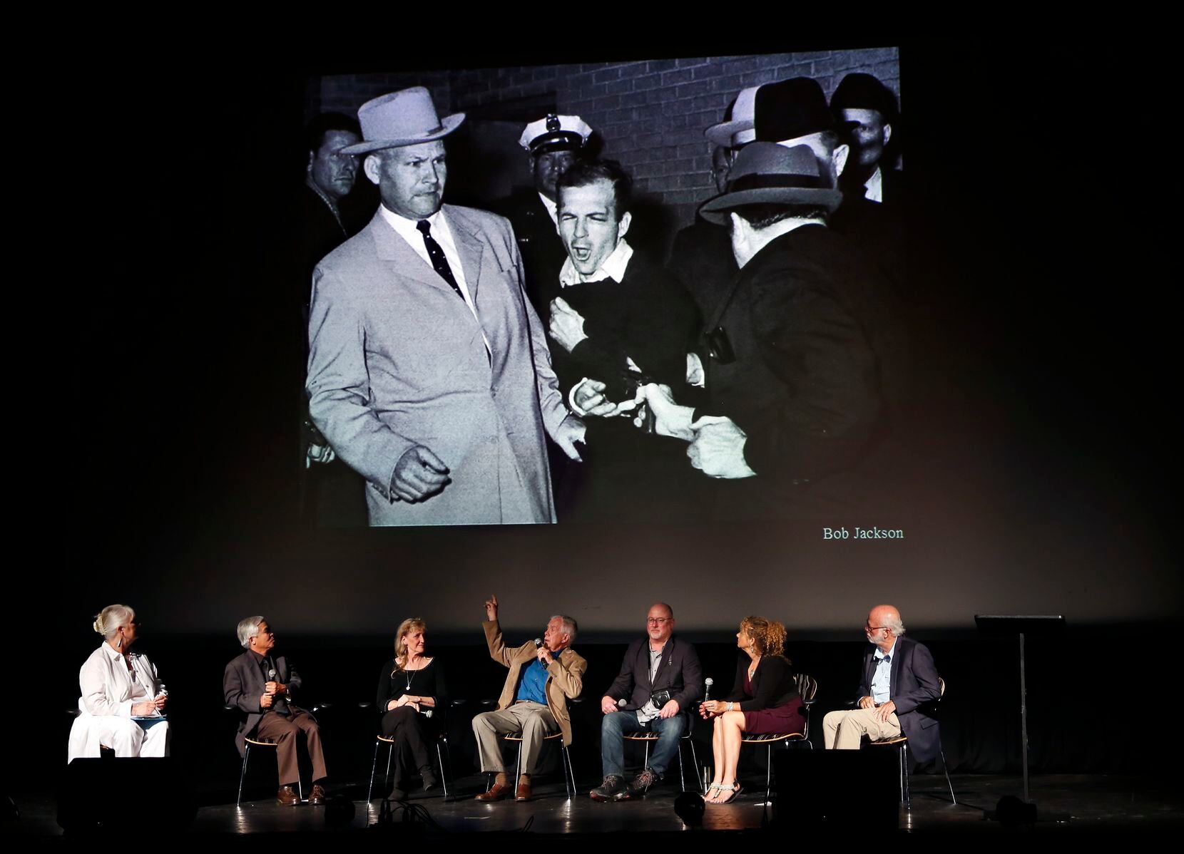 Pulitzer Prize winner Bob Jackson (center) describes his winning photo of Jack Ruby shooting...