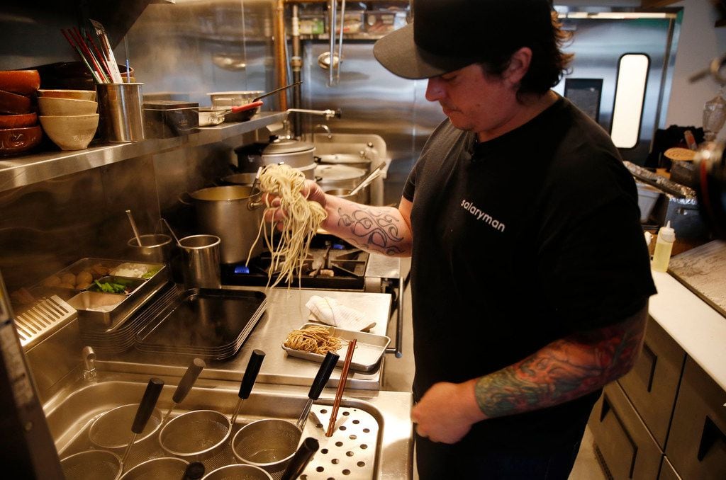 Chef Justin Holt prepares to cook noodles that took four days to make and age.