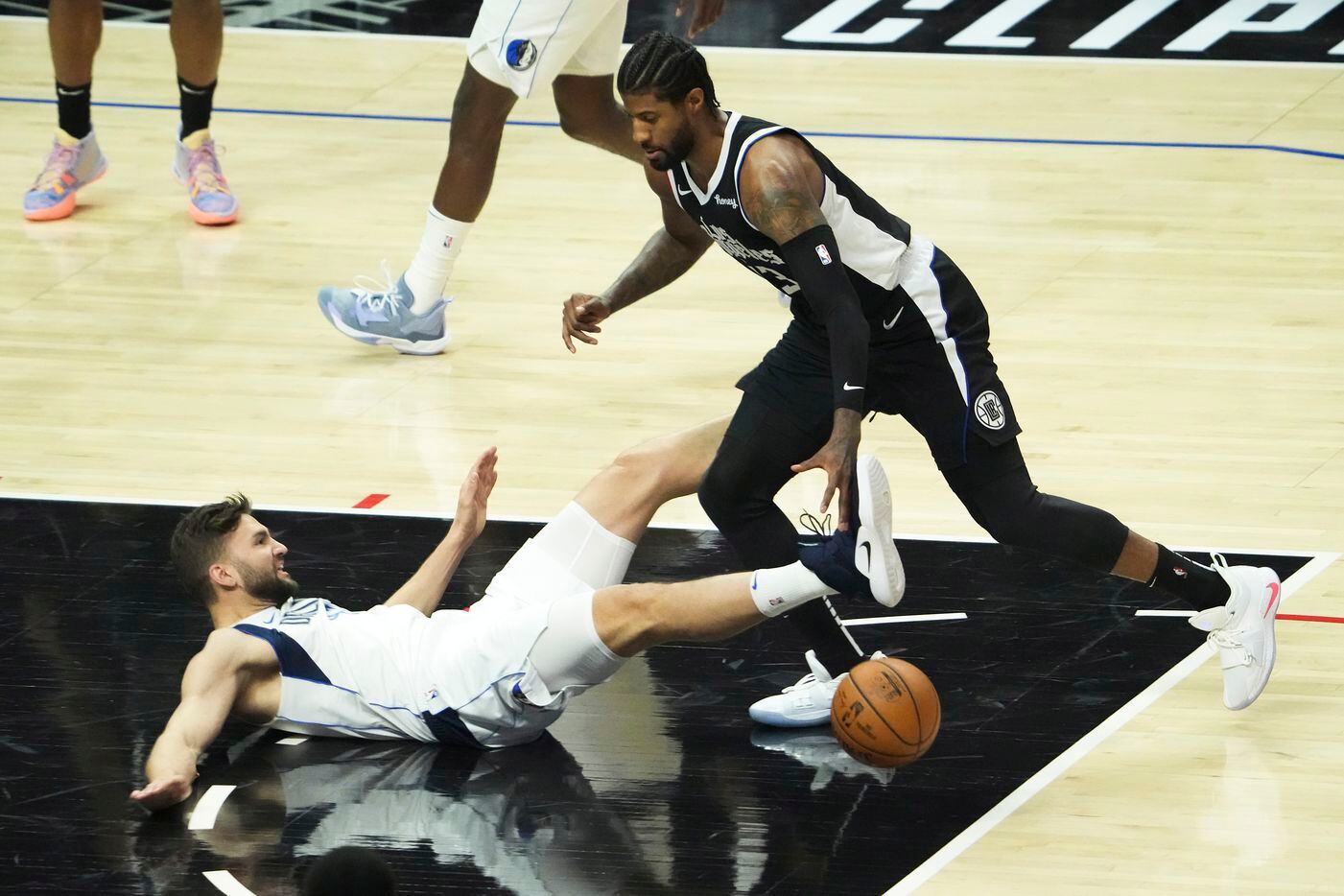 Dallas Mavericks forward Maxi Kleber (42) hist the floor as he his fouled by LA Clippers...