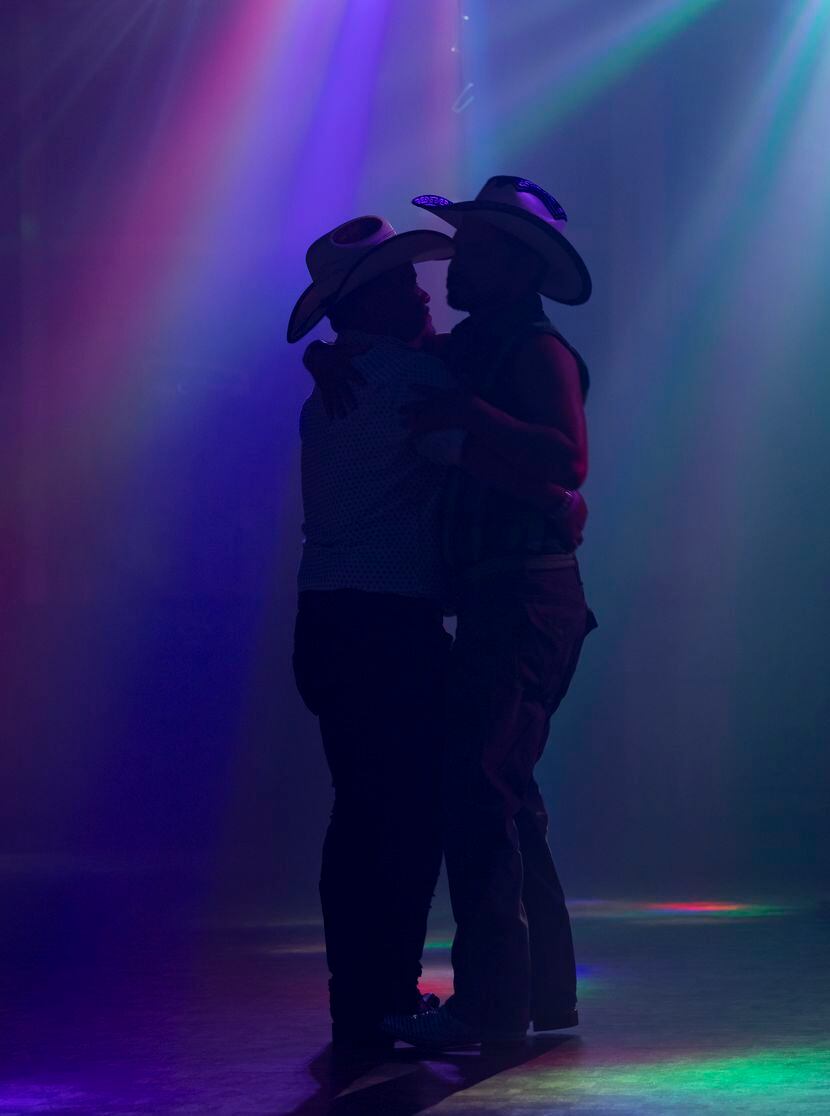 A couple wearing vaquero hats danced under the lights in June at Club Los Rieles in Dallas.