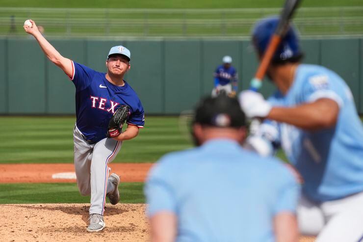 Texas Rangers pitcher Owen White delivers during the fifth inning of a spring training game...