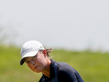 Professional golfer Esther Henseleit chips a ball onto the No. 4 green during the final...