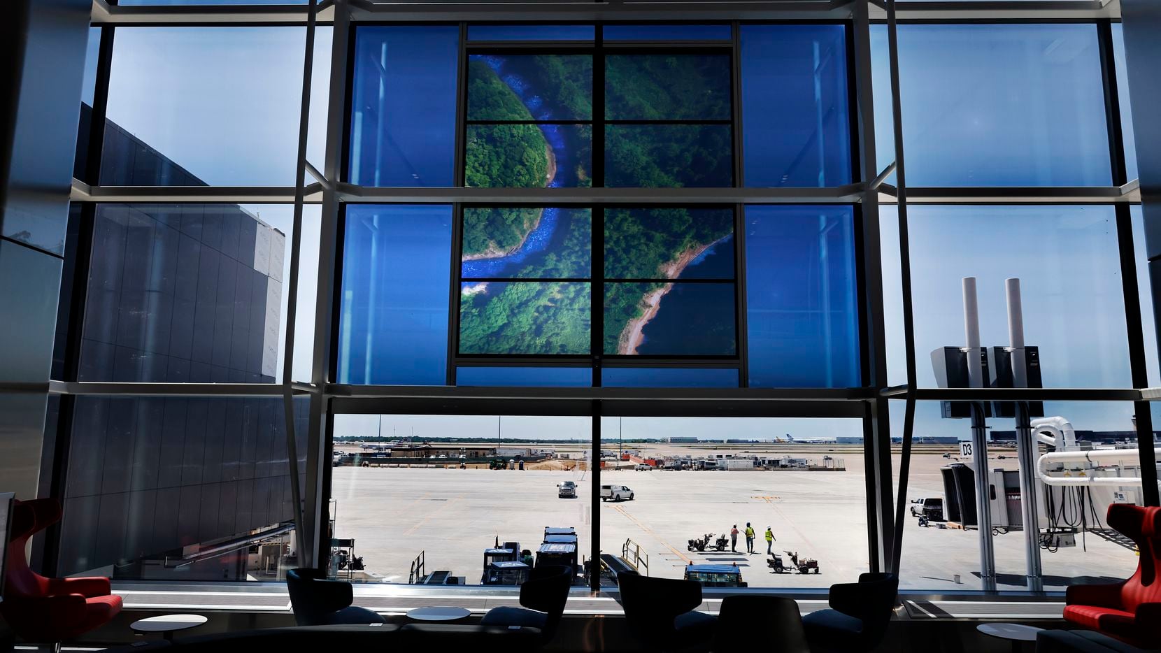 A translucent video image is displayed on the windows of the new Terminal D Extension at Dallas-Fort Worth International Airport.