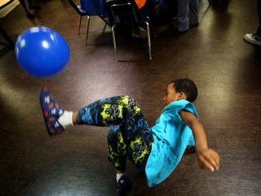 Jeremiah Ross, 6, plays with a balloon during a birthday celebration hosted by The Birthday...