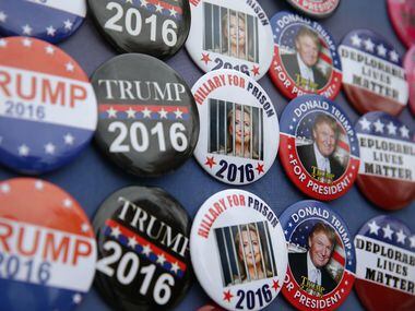Campaign buttons are seen outside a Trump campaign event November 3, 2016 in Berwyn,...