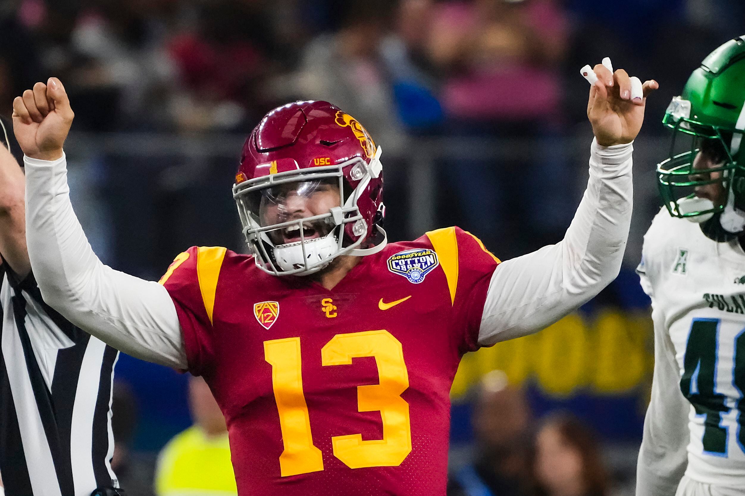 USC quarterback Caleb Williams (13) reacts after connecting with wide receiver Tahj...