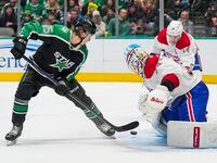 Dallas Stars left wing Joel Kiviranta (25) is turned away by Montreal Canadiens goaltender...