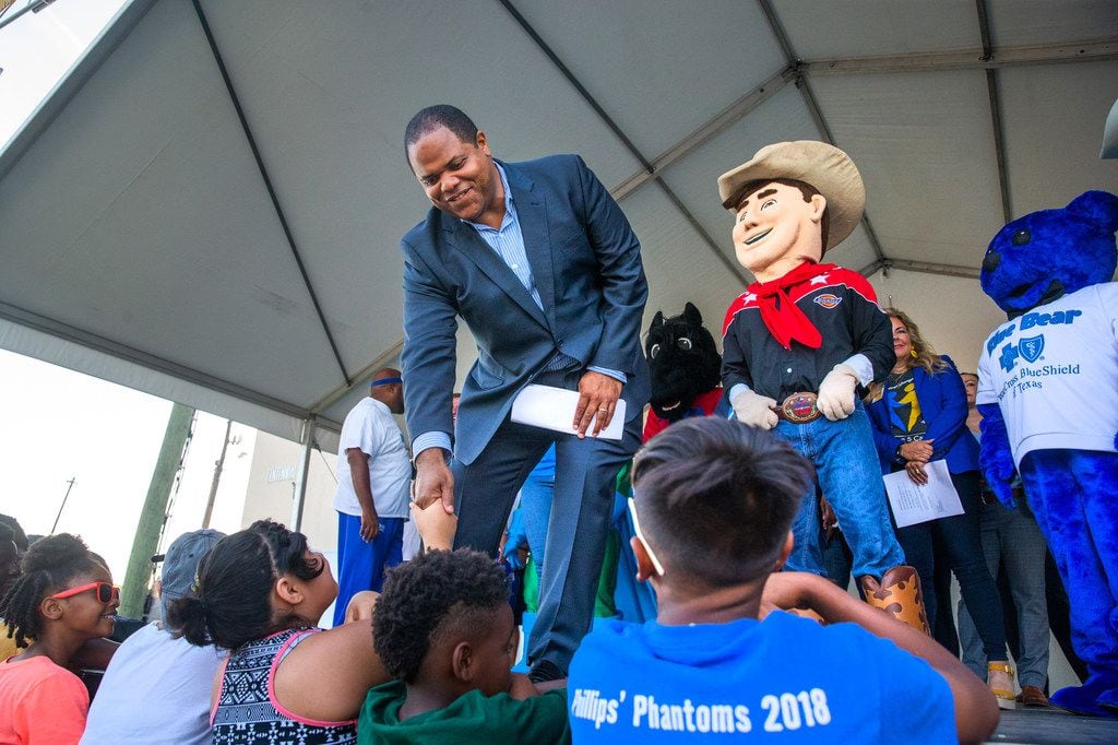 Dallas Mayor Eric Johnson (center) greets children during the 23rd annual Mayor's Back to...