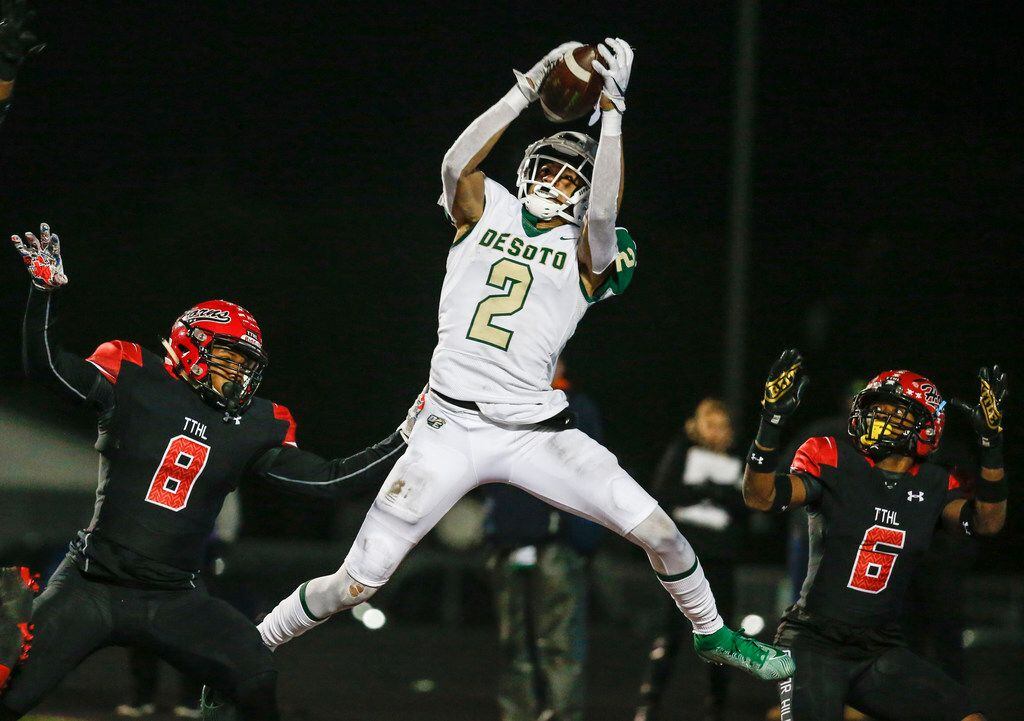 DeSoto wide receiver Lawrence Arnold brings down a touchdown pass during a high school...