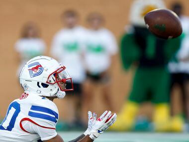SMU wide receiver Jayleen Record (20) catches a kick-off during the first quarter of a game...