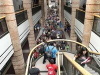 Students file through the halls of Allen High School, where the campus stretches almost a...
