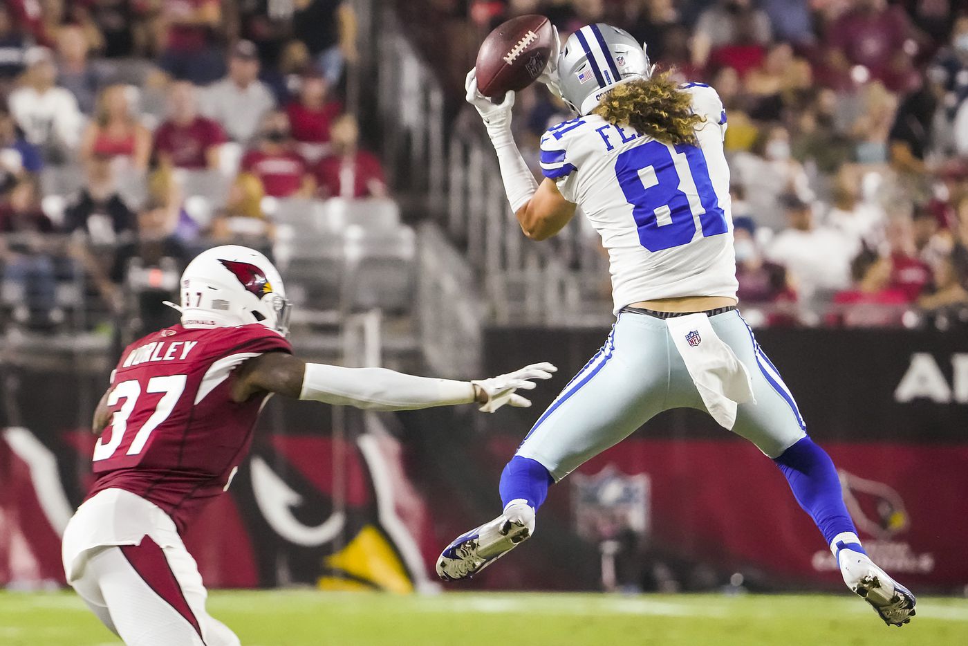 Dallas Cowboys wide receiver Simi Fehoko (81) catches a pass as Arizona Cardinals corner back Daryl Worlsey (37) defends during the second quarter of an NFL football game at State Farm Stadium on Friday, Aug. 13, 2021, in Glendale, Ariz.