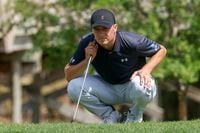 Jordan Spieth eyes his shot near the 18th green during the first round of The CJ Cup Byron...