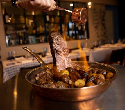 Bistecca alla fiorentina is one of the Italian dishes on the menu at Dolce Riviera in...