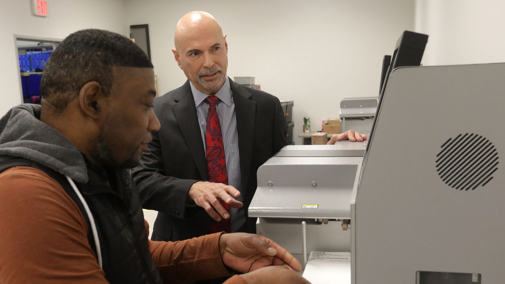Bruce Sherbet, the Collin County elections administrator, right, has a challenging job --...
