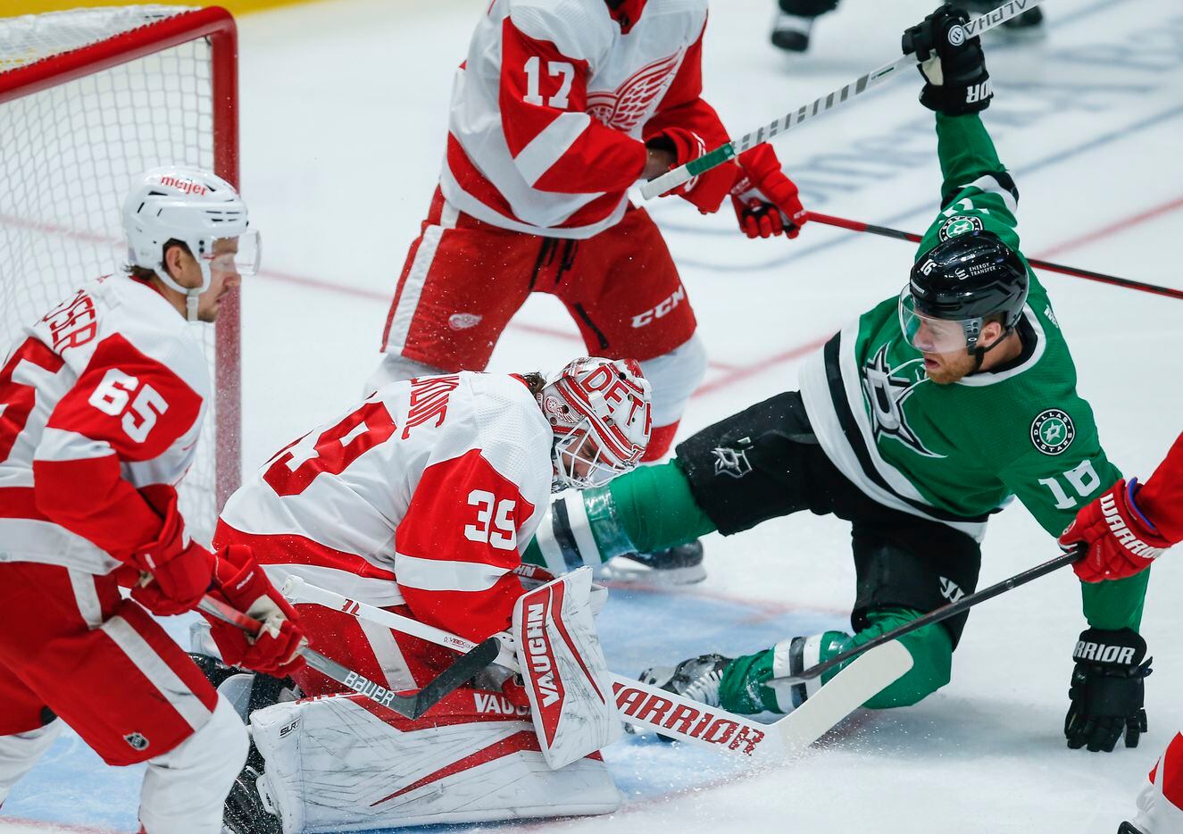 Dallas Stars center Joe Pavelski (16) looks for a rebound off of Detroit Red Wings goaltender Alex Nedeljkovic (39) during the first period of an NHL hockey game, Tuesday, November 16, 2021. (Brandon Wade/Special Contributor)