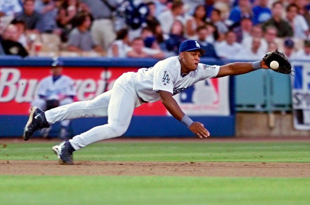 FILE - Los Angeles Dodgers' Adrian Beltre dives for a ball hit by Colorado Rockies' Vinny...