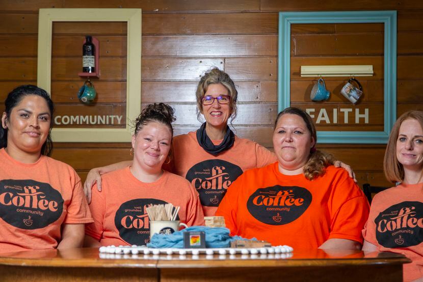 Well Grounded Coffee Community owner Natalie Huscheck (center) says her life has been...