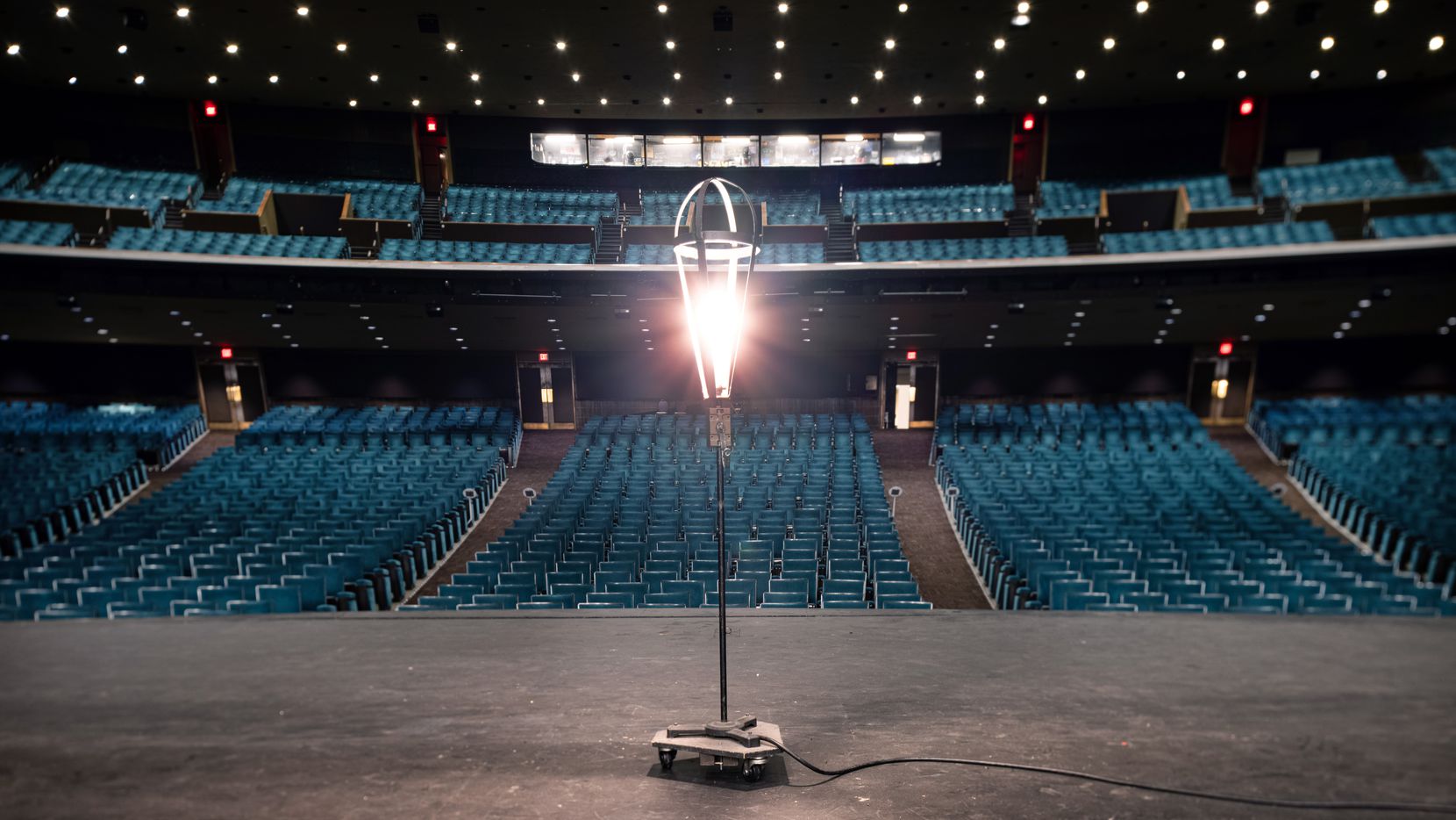 A ghost light onstage at the empty Music Hall at Fair Park in Dallas on Thursday, Feb. 4, 2021. (Juan Figueroa/ The Dallas Morning News)