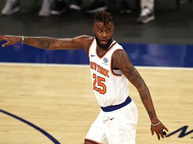 Reggie Bullock (25) of the New York Knicks celebrates his three point shot in the first quarter against the Charlotte Hornets at Madison Square Garden on May 15, 2021, in New York.