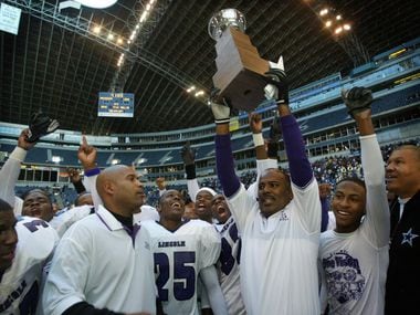  Dallas Lincoln High coach Reginald Samples  (with trophy) and assistants and team members...