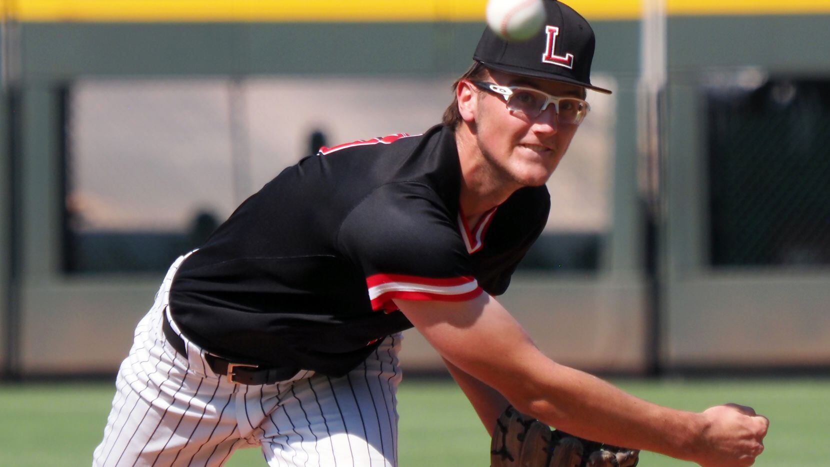 Mansfield Legacy pitcher Blake Julius pitches against Friendswood in the UIL baseball 5A...
