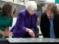 Treasury Secretary Janet Yellen, center, and U.S. Treasurer Lynn Malerba, left, inspect...