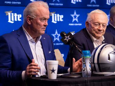 Dallas Cowboys Chief Operating Officer Stephen Jones speaks as owner Jerry Jones listens...