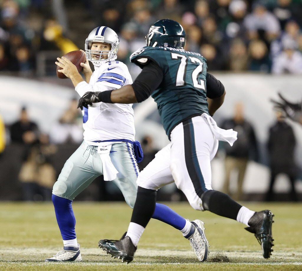 Dallas Cowboys quarterback Tony Romo (9) prepares to pass to Dallas Cowboys wide receiver...