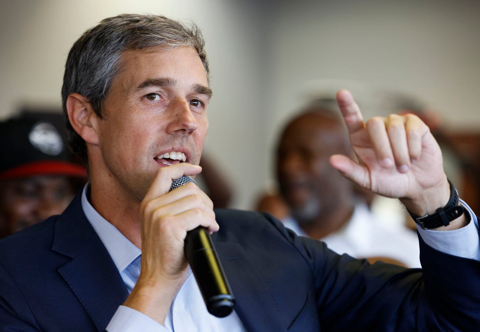 Texas Governor candidate Beto O'Rourke talks to patrons at Kutinfed Barbershop in Dallas on...