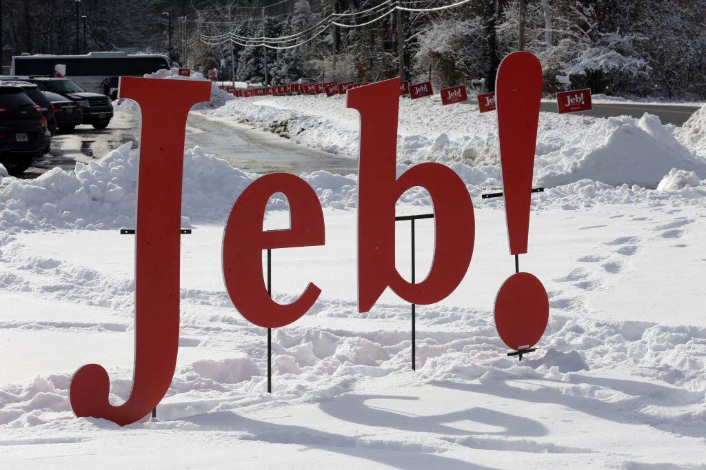  A Jeb! sign is set in a  snowbank at a school where Jeb Bush campaigned on Feb. 6, 2016, in...