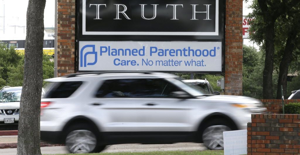 FILE - In a Monday, June 27, 2016 file photo, traffic passes a Planned Parenthood sign in...