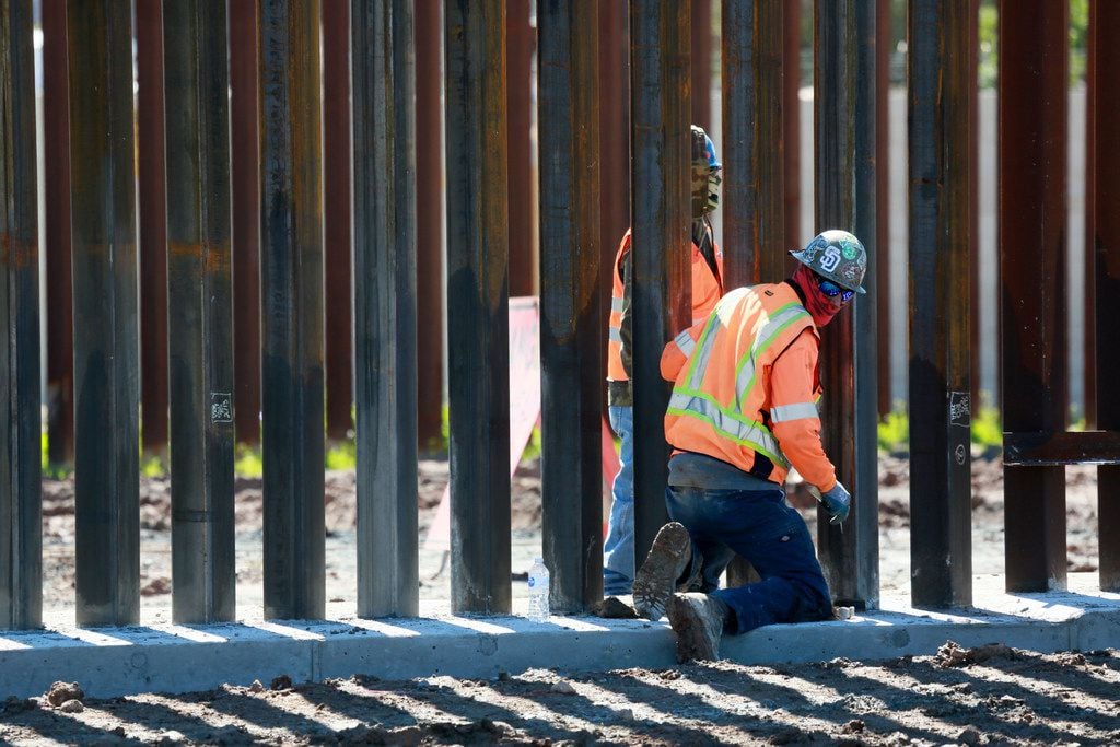 OTAY MESA, CA - FEBRUARY 22: Construction workers build a secondary border wall on February...