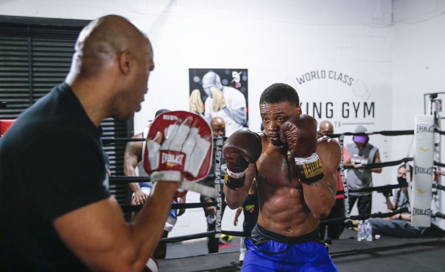Errol Spence Jr. of Desoto, right, practices with his coach Derrick James during a media...