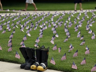 SMU students walk by a display of boots and flags on September 10, 2010 on the SMU campus. 