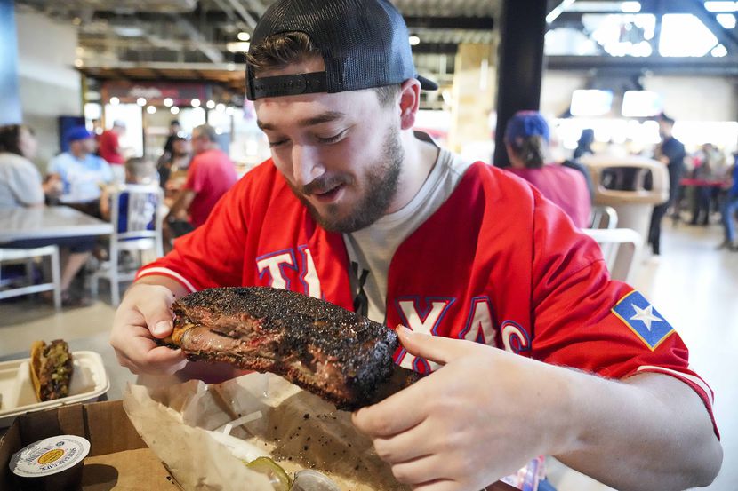 Tyler Dozier of Flower Mound prepares for his first bite of the beef rib from the Hurtado...