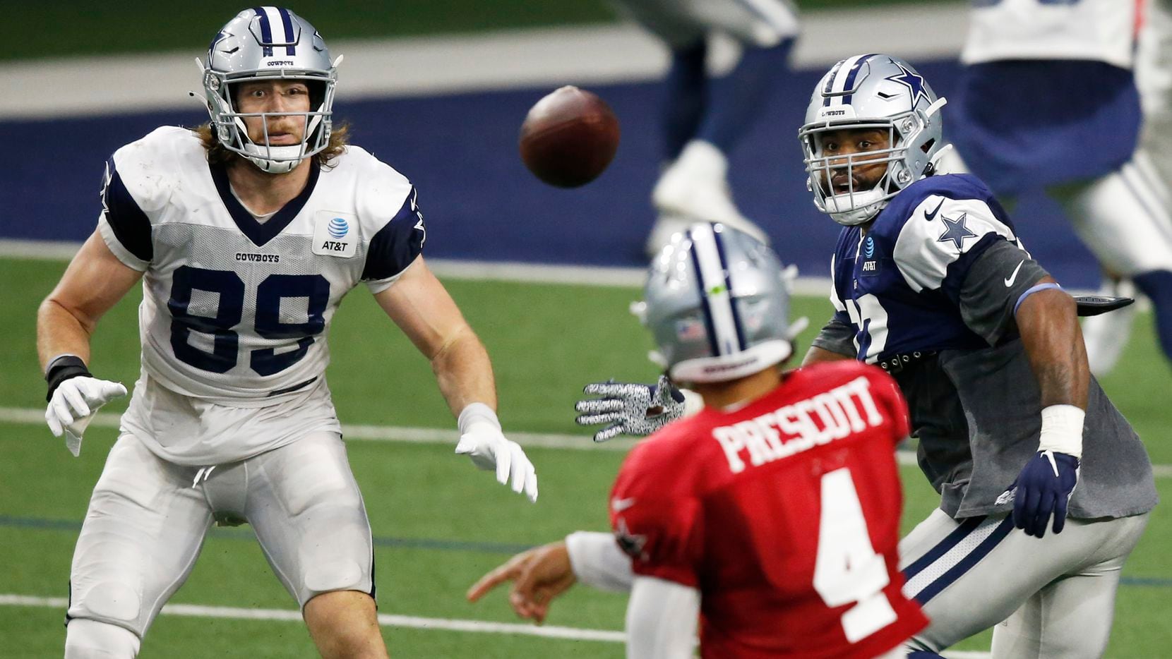 Dallas Cowboys tight end Blake Jarwin (89) watches as quarterback Dak Prescott (4) passes the ball during training camp at The Star in Frisco, Texas on Monday, August 24, 2020.